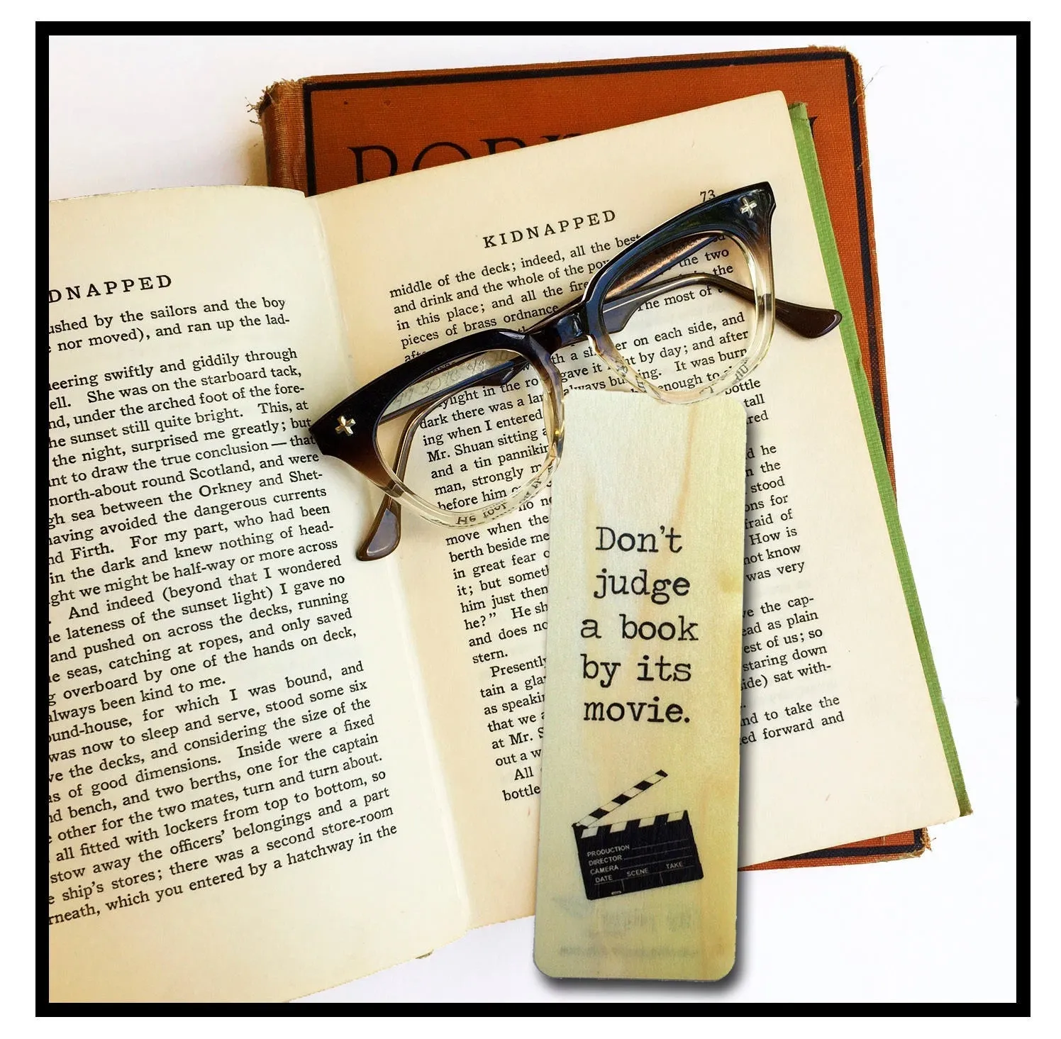 Don't judge a book by its movie. - Wood Bookmark